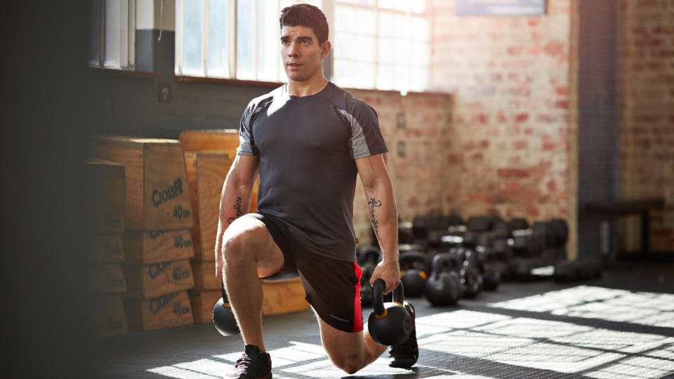 A man performing a weighted lunge