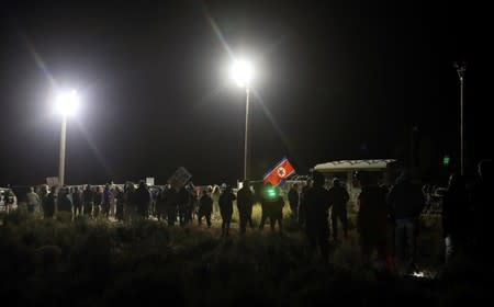 People gather outside a gate of Area 51 as an influx of tourists responding to a call to 'storm' Area 51, a secretive U.S. military base believed by UFO enthusiasts to hold government secrets about extra-terrestrials, is expected in Rachel