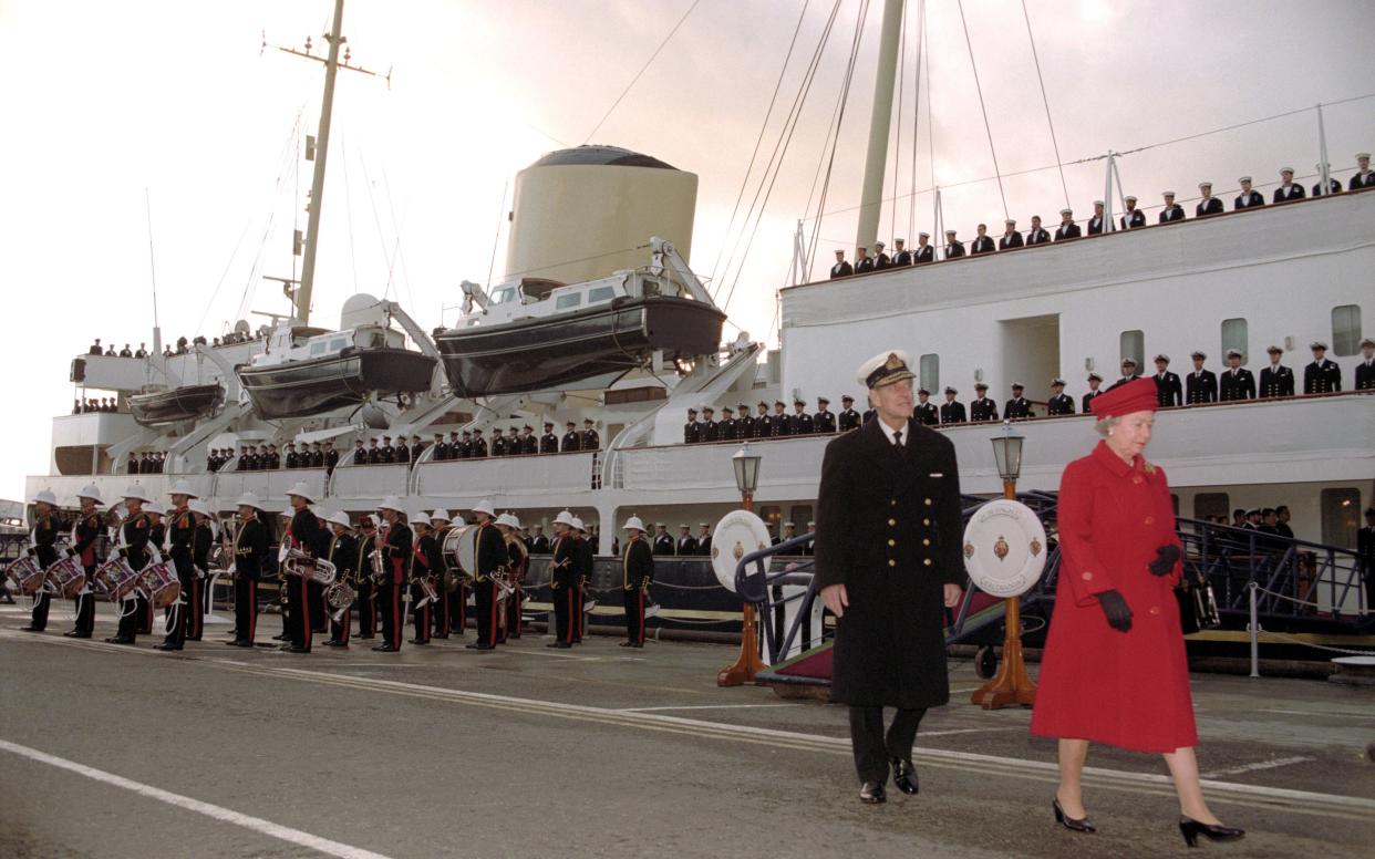 The Queen and Duke of Edinburgh leave the Royal Yacht Britannia for the last time in Portsmouth in 1997 - PA/EMPICS