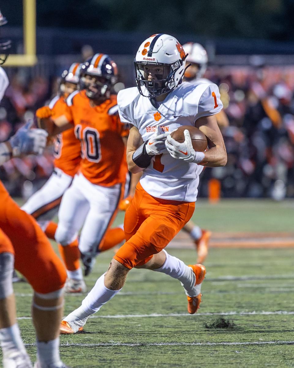 Brighton receiver Mason Millhouse looks to gain additional yardage in a 17-14 victory over Northville on Friday, Sept. 23, 2022.