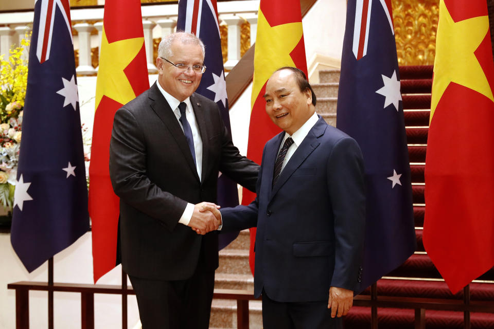 Australian Prime Minister Scott Morrison, left, and his Vietnamese counterpart Nguyen Xuan Phuc pose for a photo during a welcome ceremony at the Presidential Palace in Hanoi, Vietnam, Friday, Aug. 23, 2019. Morrison is on a three-day official visit to Vietnam. (AP Photo/Duc Thanh)