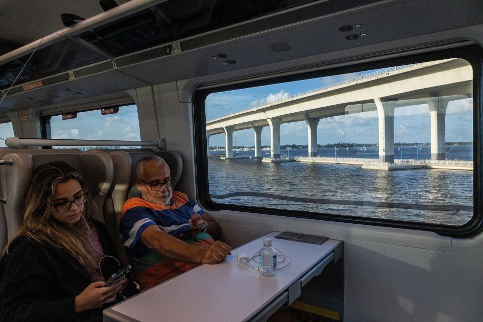 Dal Silva and daughter Luisa ride the the Brightline train to Miami from Orlando, Fla., on September 22, 2023. Silva picked up his daughter in Gainesville and they will travel to their Miami home for a weekend visit, he said.