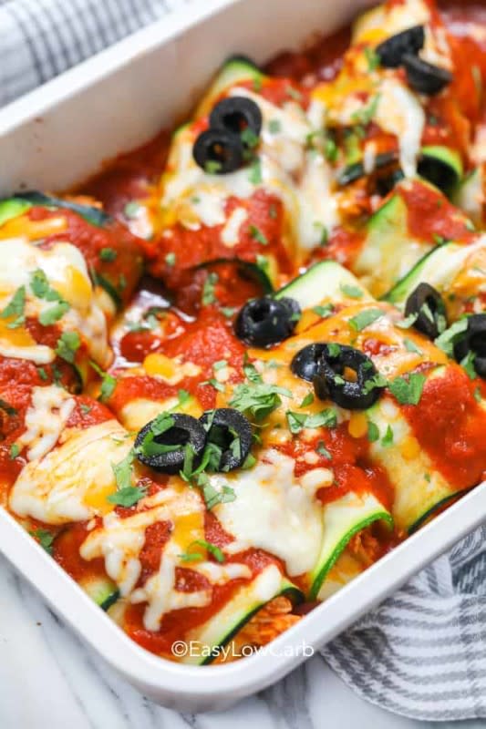 <p>Zucchini enchiladas make a heartwarming casserole the whole family will love without sacrificing your waistline!</p><p><strong>Get the recipe: <a href="https://easylowcarb.com/low-carb-zucchini-enchiladas/" rel="nofollow noopener" target="_blank" data-ylk="slk:Low Carb Zucchini Enchiladas;elm:context_link;itc:0;sec:content-canvas" class="link rapid-noclick-resp">Low Carb Zucchini Enchiladas</a></strong></p>