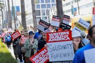 Members of the Writers Guild of America protest in Los Angeles