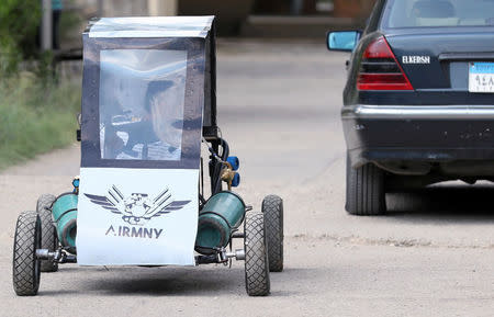 Mahmoud Yasser, mechanical engineering student from Helwan University, drives the air-powered vehicle which he helped design to promote clean energy and battle increasing gas prices, in Cairo, Egypt August 7, 2018. Picture taken August 7, 2018. REUTERS/Mohamed Abd El Ghany