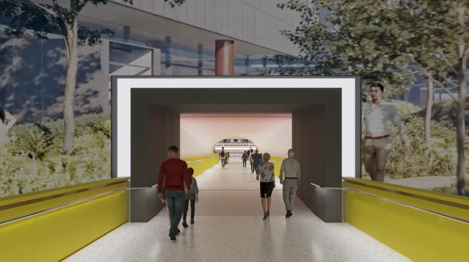 A digital rendering of the new tunnel being added at the Pittsburgh International Airport (PIT) to connect the landside and airside terminals. A digital screen will be located around the tunnel, capable of showing informational video or ads.