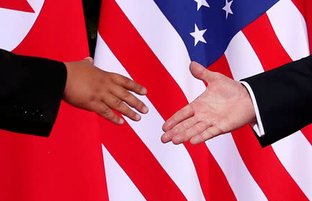 FILE PHOTO: U.S. President Donald Trump shakes hands with North Korean leader Kim Jong Un at the Capella Hotel on Sentosa island in Singapore June 12, 2018. REUTERS/Jonathan Ernst/File Photo