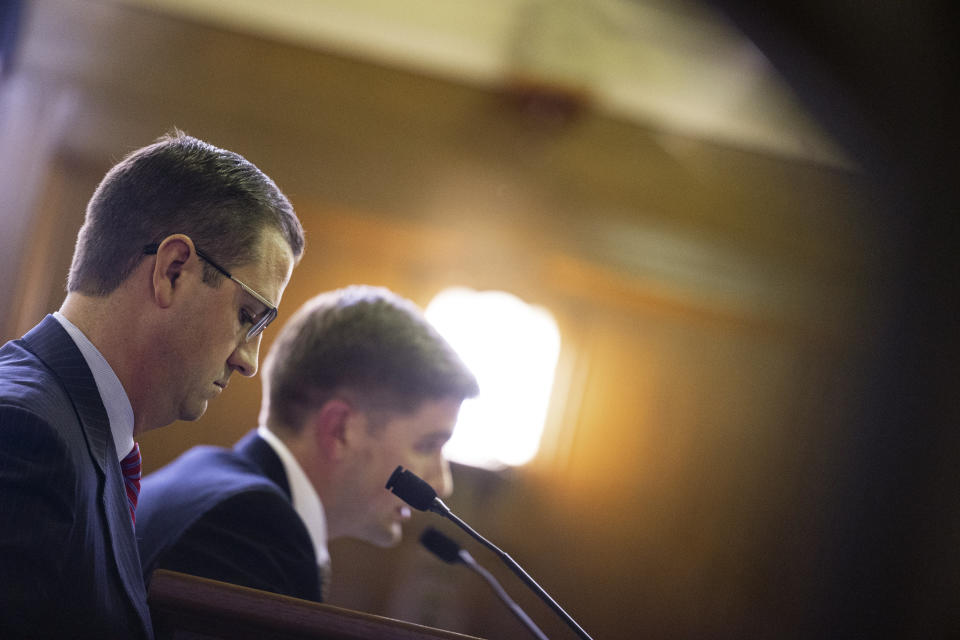 Republican gubernatorial hopeful Michael Markey Jr., left, accompanied by his lawyer Garett Koger speaks to the Board of State Canvassers during a meeting at the Senate hearing room inside Boji Tower in Lansing, Mich., Thursday, May 26, 2022. (Joel Bissell/The Grand Rapids Press via AP)