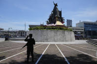 An army soldier stands guard beside the People's Power Monument in Quezon City, Philippines on Friday May 27, 2022. Filipino voters overwhelmingly elected Ferdinand "Bongbong" Marcos Jr., as president during the May 2022 elections, completing a stunning return to power for the family of the late President Ferdinand Marcos, Sr., who ruled the country for more than two decades until being ousted in 1986 in the nonviolent "People Power" revolution. (AP Photo/Aaron Favila)