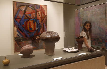 A visitor looks at artwork displayed at the Sursock Museum in Beirut, Lebanon October 9, 2015. REUTERS/Jamal Saidi