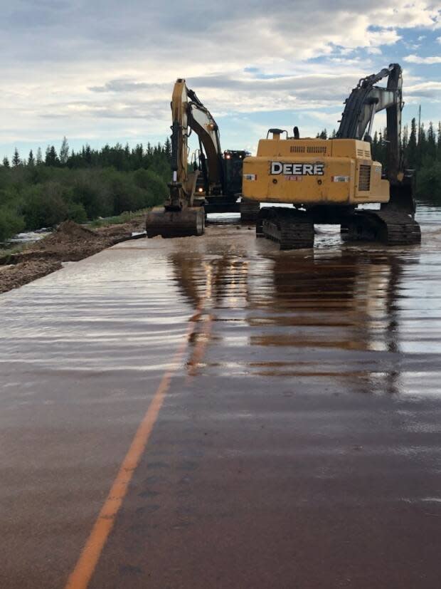 Crews install a portable temporary bridge at kilometer 42 on Highway 1 on June 21, 2021. (N.W.T. Department of Infrastructure - image credit)