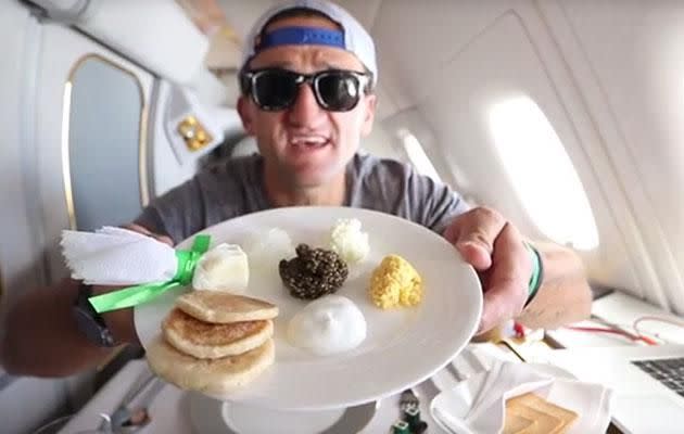 It's caviar all the way for Casey during his first class eating adventure. Image: Youtube/CaseyNeistat