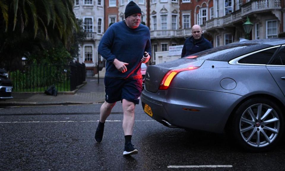 Boris Johnson returns to his house after an early morning run ahead of his committee appearance.