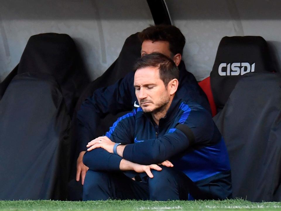 Frank Lampard watches on as his side crumble: Getty