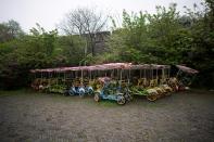 Vehicles for tourists are seen parked at an ancient city wall in Jingzhou, after the lockdown was eased in Hubei