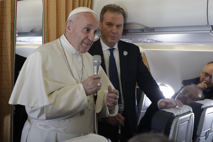 Pope Francis talks to journalist on board of a plane on his way to Dublin, Ireland, Saturday, Aug. 25, 2018. Pope Francis is on a two-day visit to Ireland. (AP Photo/Gregorio Borgia, Pool)