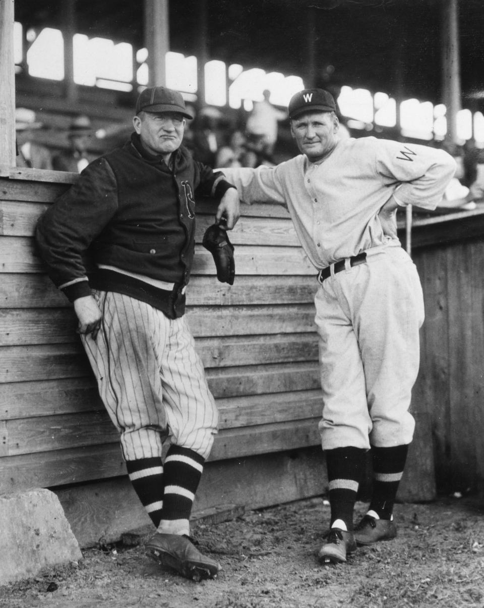 Brooklyn's Dazzy Vance, left, in a jacket we'd wear today, with Walter Johnson before a 1912 game in Hot Springs, Arkansas.