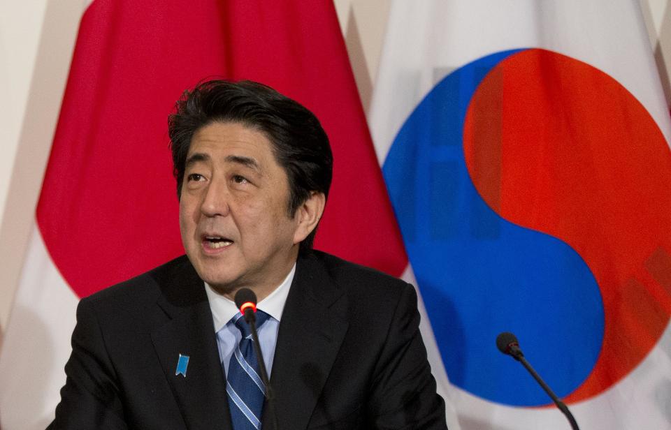 Japanese Prime Minister Shinzo Abe speaks during a trilateral meeting with President Barack Obama and South Korean President Park Geun-hye, Tuesday, March 25, 2014, at the US Ambassador's Residence in the Hague, Netherlands. (AP Photo/Pablo Martinez Monsivais)