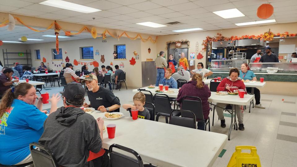 Community members enjoy a Thanksgiving meal Thursday at the Salvation Army in downtown Amarillo.