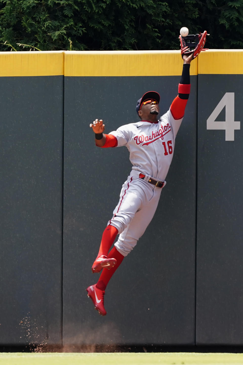 Washington Nationals center fielder Victor Robles (16) catches a ball off the bat of Atlanta Braves' Austin Riley in the second inning of a baseball game Thursday, June 3, 2021, in Atlanta. (AP Photo/John Bazemore)