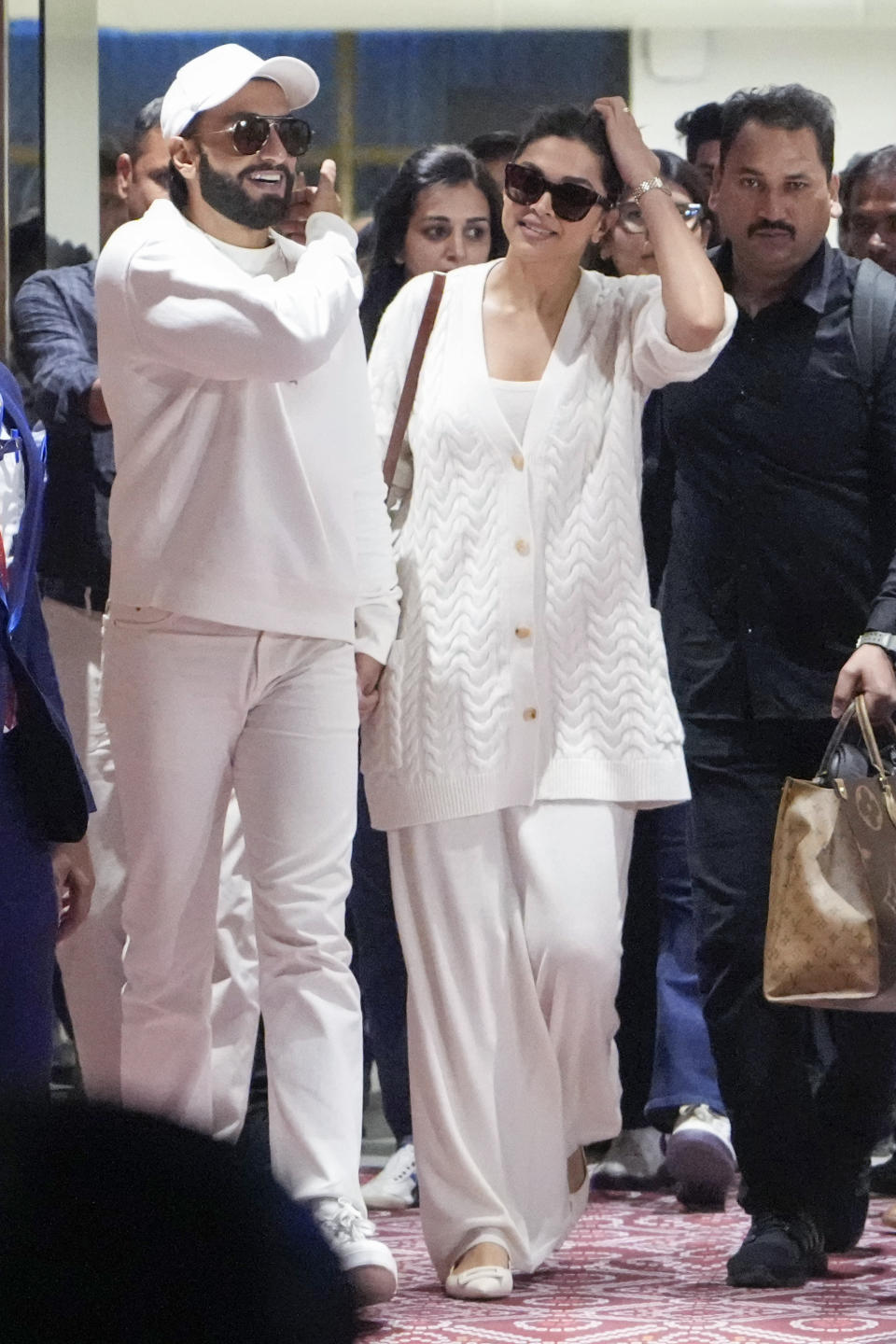 Bollywood actors Ranveer Singh, left and Deepika Padukone arrive at airport to attend the pre-wedding celebrations of Anant Ambani and Radhika Merchant in Jamnagar, India, Thursday, Feb. 29, 2024. (AP Photo/Ajit Solanki)