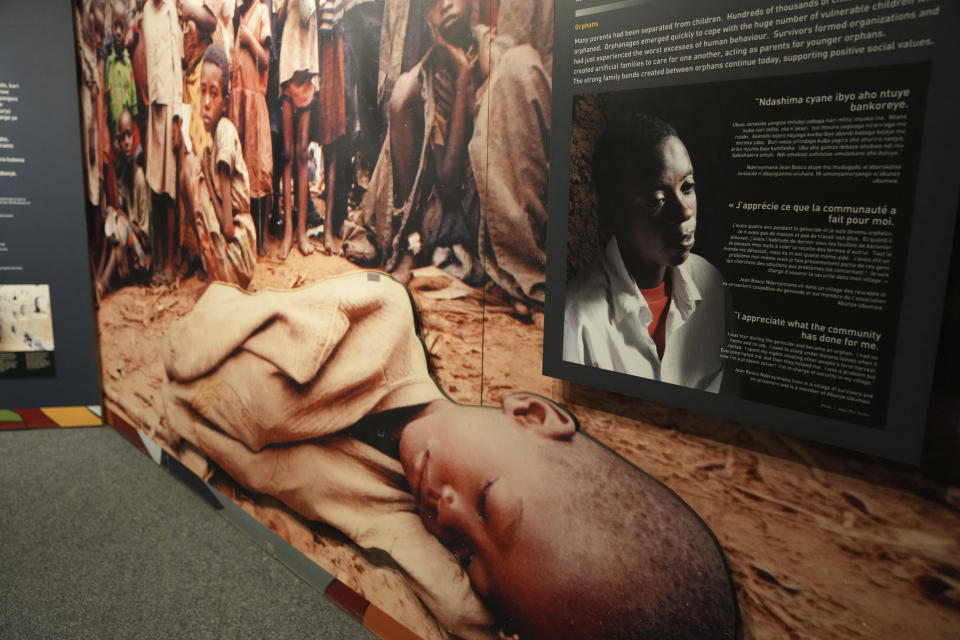 Family photographs of some of those who died hang in a display in the Kigali Genocide Memorial Centre in Kigali, Rwanda, Tuesday, April 4, 2024. The country will commemorate on April 7, 2024 the 30th anniversary of the genocide when ethnic Hutu extremists killed neighbours, friends and family during a three-month rampage of violence aimed at ethnic Tutsis and some moderate Hutus, leaving a death toll that Rwanda puts at 1,000,050. (AP Photo/Brian Inganga)