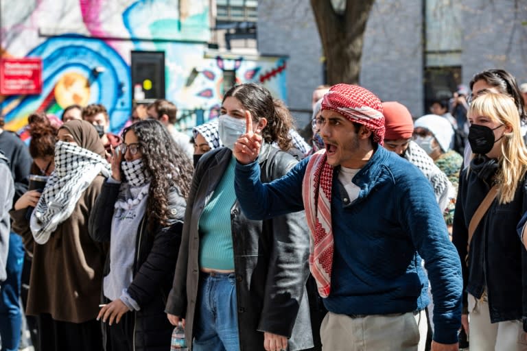 Pro-Palestinian protesters stand in front of a police barricade at Northeastern University in Boston, Massachusetts, on April 27, 2024 (Joseph Prezioso)