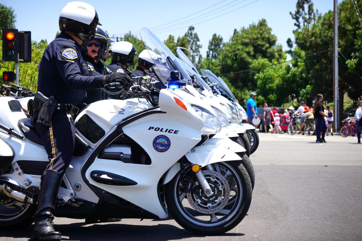 <p>Huntington Beach Police motorcycle officers direct crowds and traffic in 2019</p> (Getty/iStock)