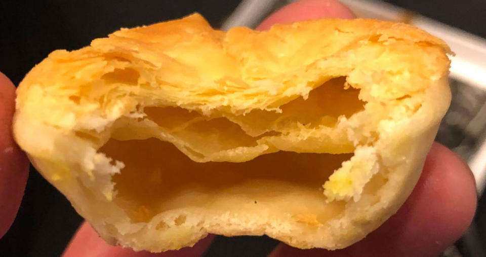 An Adelaide Crows fan claims to have eaten a Balfours Bakery meat pie with no filling in it.