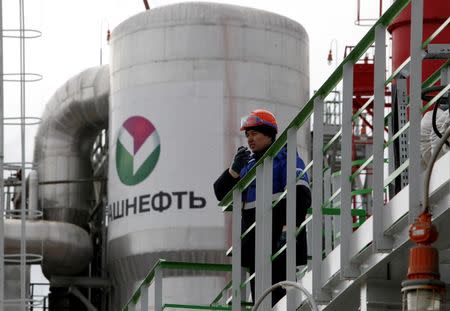 An employee talks on a portable radio set at Bashneft - Novoil refinery in the city of Ufa, Bashkortostan, Russia, April 11, 2013. REUTERS/Sergei Karpukhin/File Photo