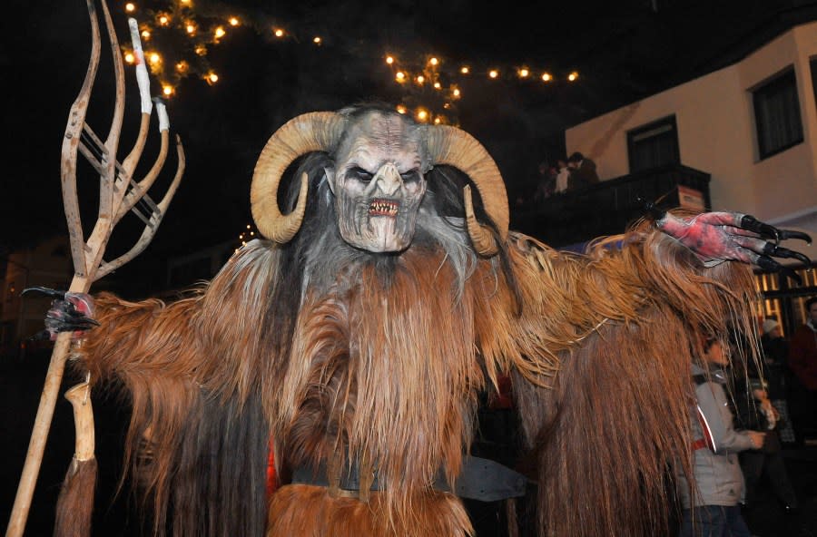 A man dressed as a Krampus, the companion of St. Nicholas and one of Austria’s unique Advent traditions, is seen during a traditional Krampus procession in the city of Unken in Salzburg province on Friday, Dec. 5, 2008. (AP Photo/Kerstin Joensson)