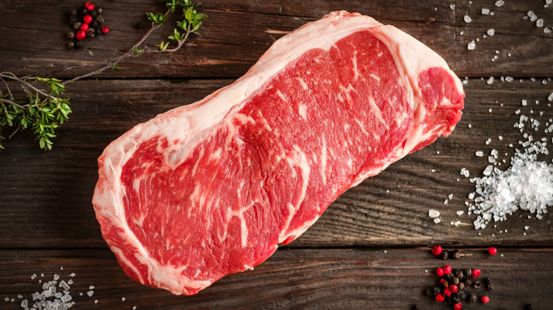 A raw New York strip steak.