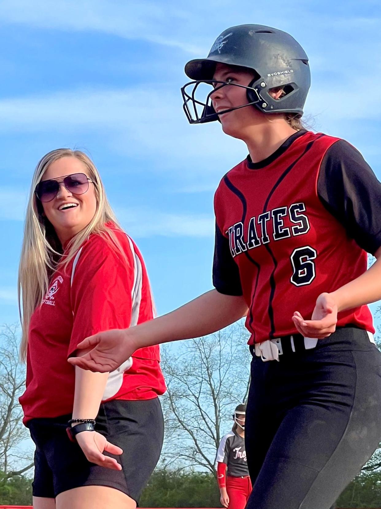 New Cardington softball coach Baylee Adams has a moment with senior Genevieve Longsdorf during a game at Centerburg this season.