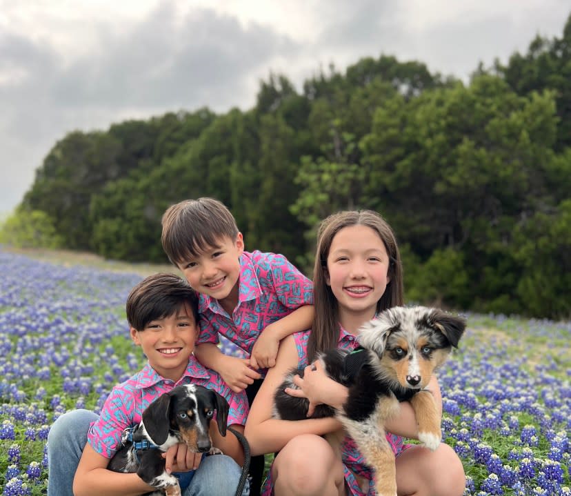 Family enjoys the bluebonnets along with their dogs (KXAN Viewer Photo)