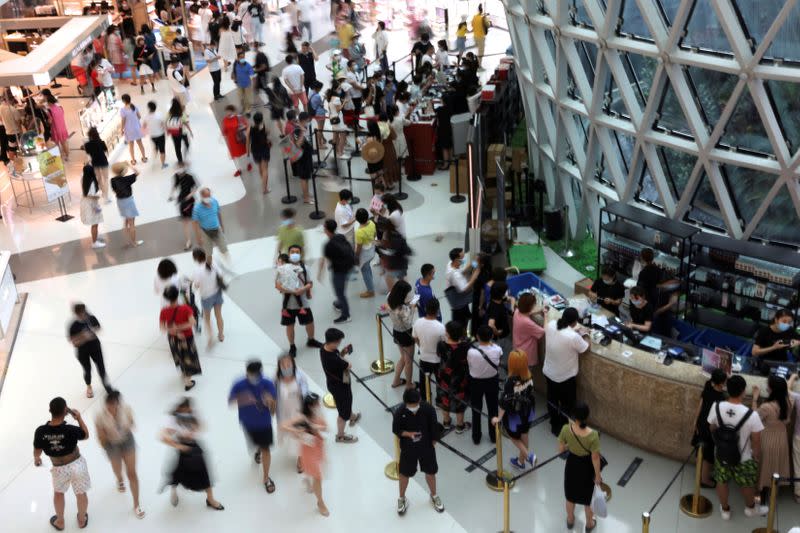 FILE PHOTO: FILE PHOTO: People shop at the Sanya International Duty-Free Shopping Complex in Sanya