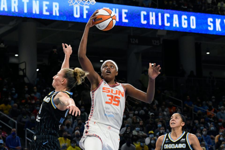 Connecticut Sun's Jonquel Jones (35) goes up for a shot against Chicago Sky's Courtney Vandersloot and Candice Parker. The WNBA playoffs begin this week and Jones, the league's reigning MVP, is hoping to deliver the franchise's first championship.  
(Photo: Paul Beaty, AP)