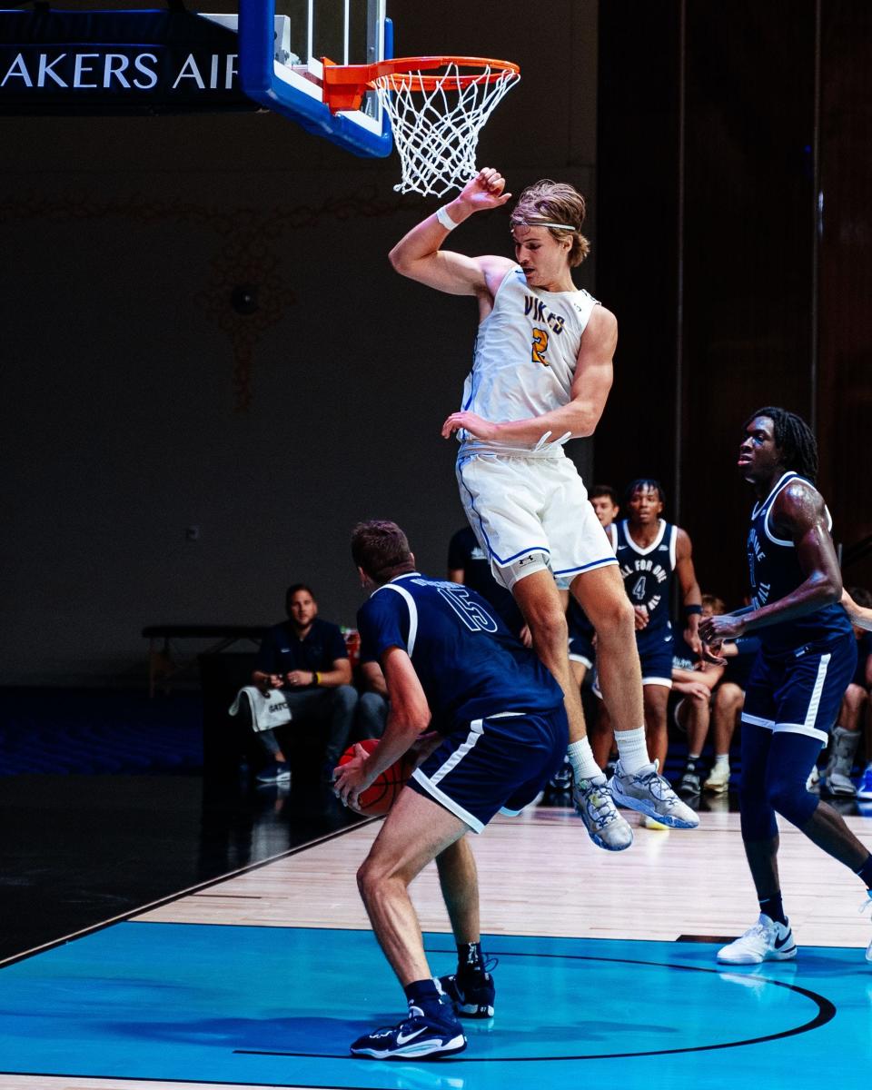 Xavier's Logan Duncomb (15) goes up for a shot against the University of Victoria in the Baha Mar Hoops Summer League on Aug. 8.