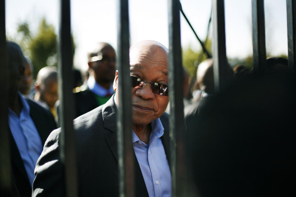 FILE - South African President Jacob Zuma speaks to school children before a political rally of the African National Congress (ANC) in the Soweto township in Johannesburg, on June 14, 2013. Zuma was briefly taken to prison and released to correctional supervision. (AP Photo/Jerome Delay, File)