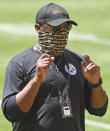 FILE - In this Aug. 17, 2020, file photo, Pittsburgh Steelers head coach Mike Tomlin looks on during practice at Heinz Field in Pittsburgh. On Sunday, Oct. 25, Steelers-Titans will be the eighth time in league history undefeated and untied teams with at least five wins have met in the regular season, the sixth such game since the 1970 merger, and only the fifth in the past 46 seasons. (Chaz Palla/Pittsburgh Tribune-Review via AP, File)