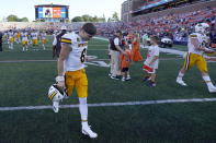 Wyoming quarterback Andrew Peasley walks off the field after his team's loss to Illinois in an NCAA college football game Saturday, Aug. 27, 2022, in Champaign, Ill. (AP Photo/Charles Rex Arbogast)