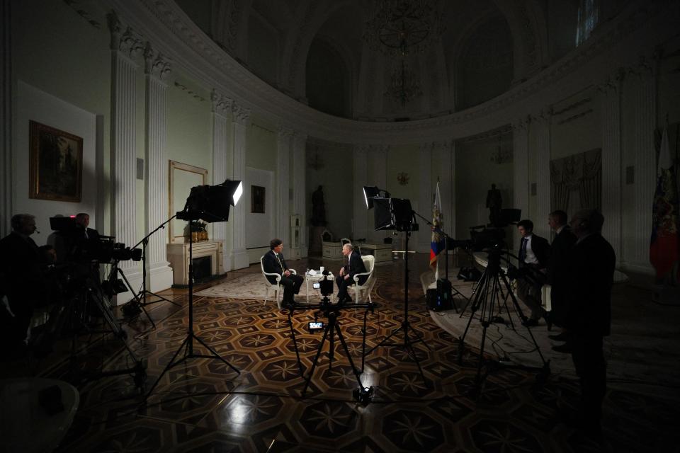 In this pool photograph distributed by Russian state agency Sputnik, Russia's President Vladimir Putin gives an interview to US talk show host Tucker Carlson at the Kremlin in Moscow on February 6, 2024 (POOL/AFP via Getty Images)