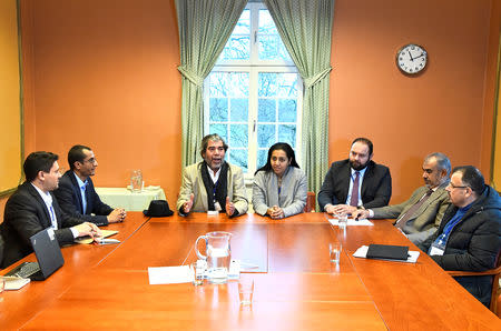 At left, Abdelqader al-Murtada and Saelem Mohammed Noman Al-Mughalles, representatives of the Ansar Allah delegation and at right, Askar Zaeil and Hadi al-Hayi representing the delegation of the Government of Yemen sit at the negotiating table together with representatives from the office of the U.N. Special Envoy for Yemen and the International Red Cross Committee (ICRC) when lists of prisoners are exchanged, a first step to implement the agreement to release all prisoners by the two parties, during the ongoing peace talks on Yemen held at Johannesberg Castle, in Rimbo, near Stockholm, Sweden, December 11, 2018. TT News Agency/Claudio Bresciani via REUTERS