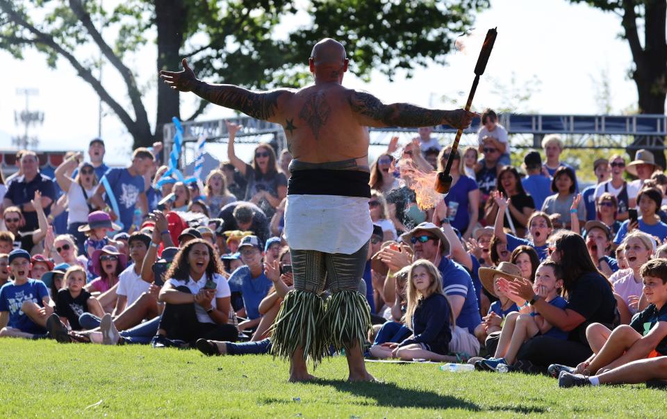 Fire Knife Dancer Martin Tevaga acknowledges the crowd as his group performs as BYU holds a party to celebrate their move into the Big 12 Conference with music, games and sports exhibits in Provo on Saturday, July 1, 2023. | Scott G Winterton, Deseret News