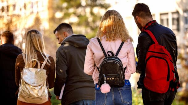 PHOTO: A group of college students walk on their university campus in a stock image. (Damircudic/Getty Images)