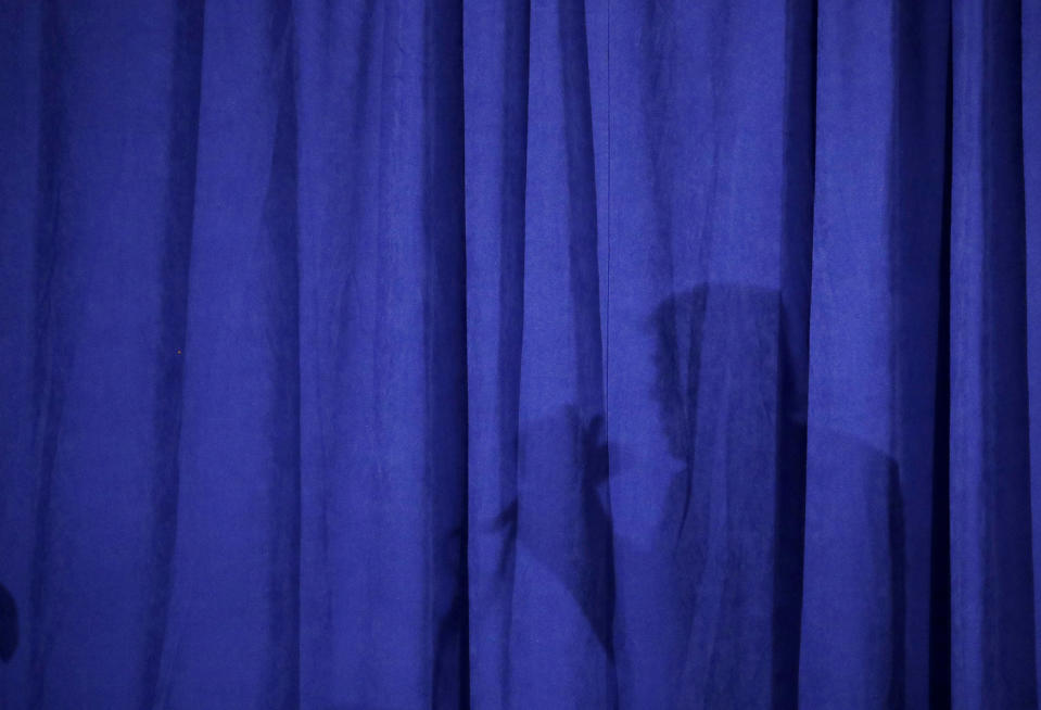 <p>Republican presidential candidate Donald Trump casts a shadow on a curtain as he speaks at the Polish National Alliance, Sept. 28, 2016, in Chicago. (Photo: John Locher/AP) </p>