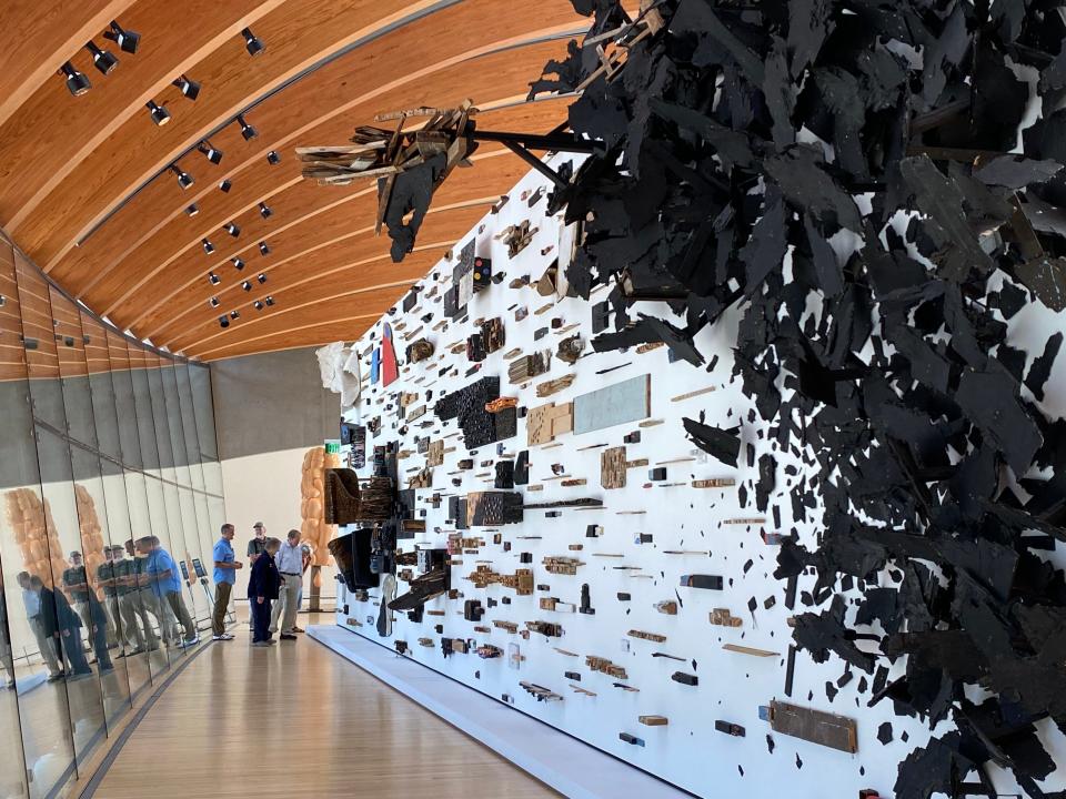 Artist Leonardo Drew created the composition “Number 184T” for this light-filled space at the Crystal Bridges Museum of American Art. Natural light flows into the curved glass bridge. Two spring-fed ponds and 120 wooded acres of native forest surround the museum.