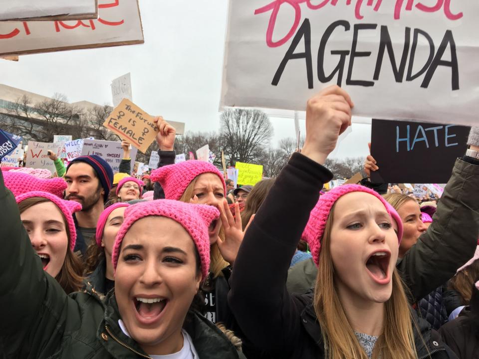 <p>Women with bright pink hats and signs begin to gather early and are set to make their voices heard on the first full day of Donald Trump’s presidency, Jan. 21, 2017, in Washington, D.C. (Photo: Mary F. Calvert for Yahoo News) </p>
