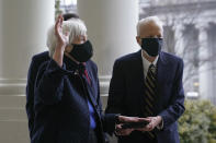 Treasury Secretary Janet Yellen, left, and Yellen's husband George Akerlof participate in a swearing-in ceremony with Vice President Kamala Harris, Tuesday, Jan. 26, 2021, at the White House in Washington. (AP Photo/Patrick Semansky)