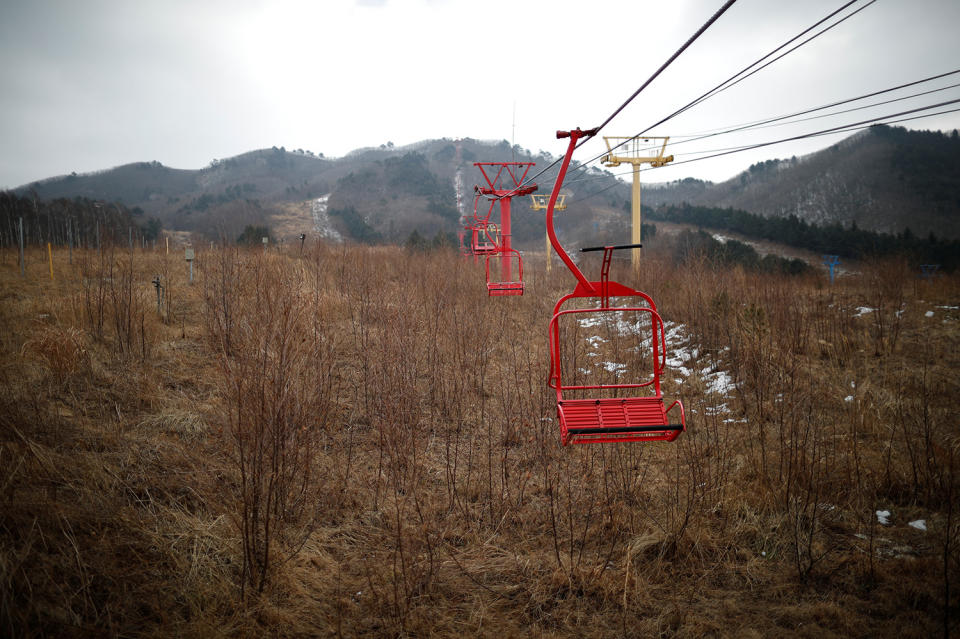 <p>Ski lift chairs hang at the abandoned Alps Ski Resort located near the demilitarized zone separating the two Koreas in Goseong, South Korea, Jan. 17, 2018. (Photo: Kim Hong-Ji/Reuters) </p>