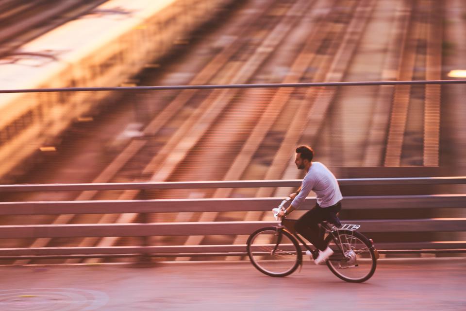 Justin Kosmides, co-founder and CEO of Vela Bikes, rides one of the company's E-bikes.